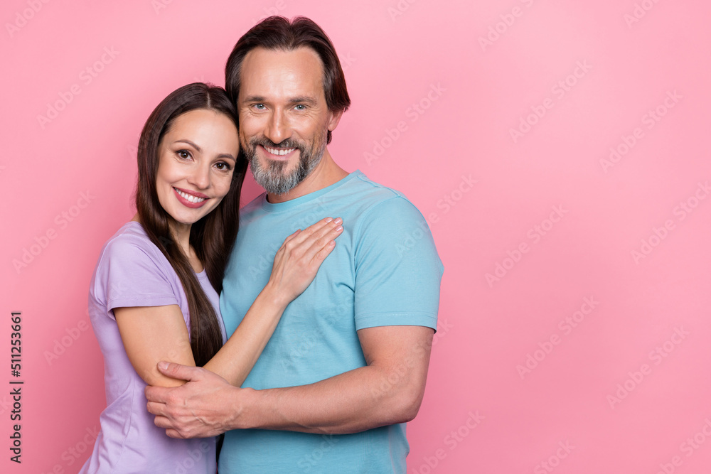 Naklejka premium Photo of two peaceful positive people embrace toothy smile isolated on pink color background