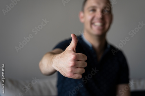 06.09.2022 - Pleven,Bulgaria - Young man showing thumbs up and smiling - closeup shot