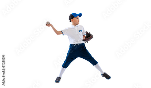 Little boy, baseball player, pitcher in blue-white uniform training isolated on white studio background. Concept of sport, achievements, studying, competition