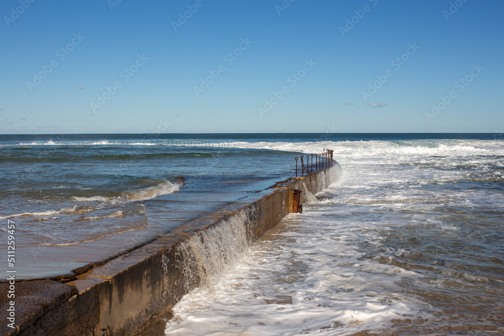 concrete water overflow at the beach concrete water overflow at the beach