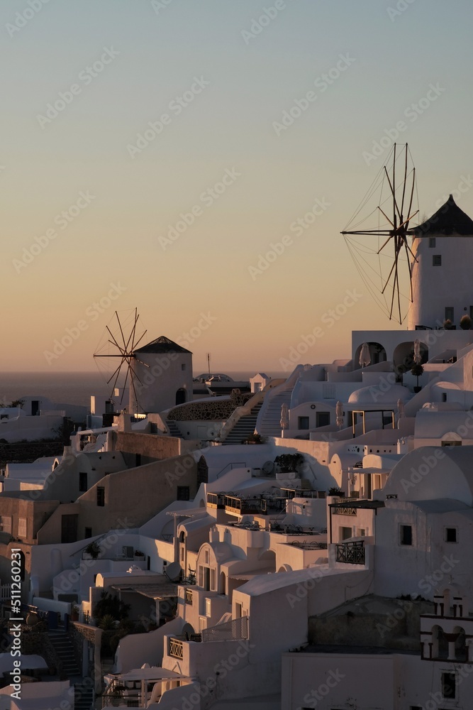 Fototapeta premium View of Oia, the most stunning village of Santorini and an amazing sunset