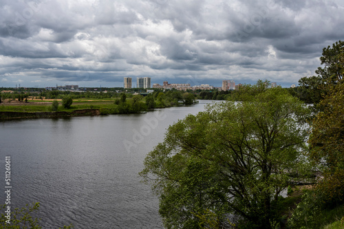 urban landscape on a summer day with river houses and woodlands © константин константи