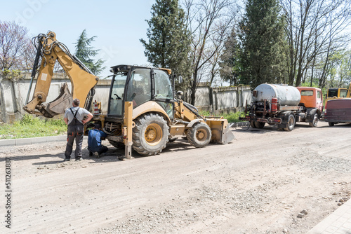 Asphalt machine that is on the road and is ready to work.