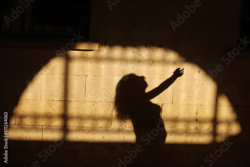 silhouette of a child playing with a ball