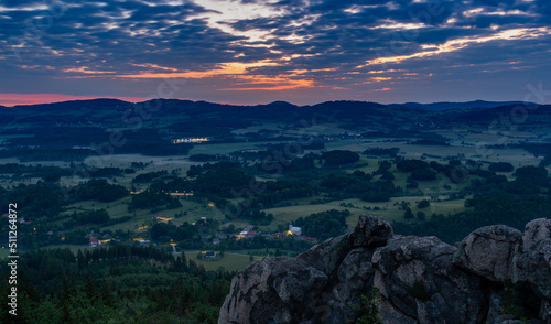Sunrise in the mountains. Rudawy Janowickie, Poland. Panorama from the top of the mountain
