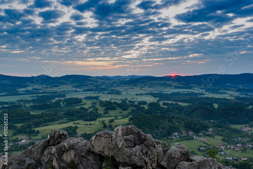 Sunrise in the mountains. Rudawy Janowickie, Poland. Panorama from the top of the mountain