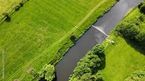 Aerial view looking down onto the river Calder in Whalley Lancashire England. 