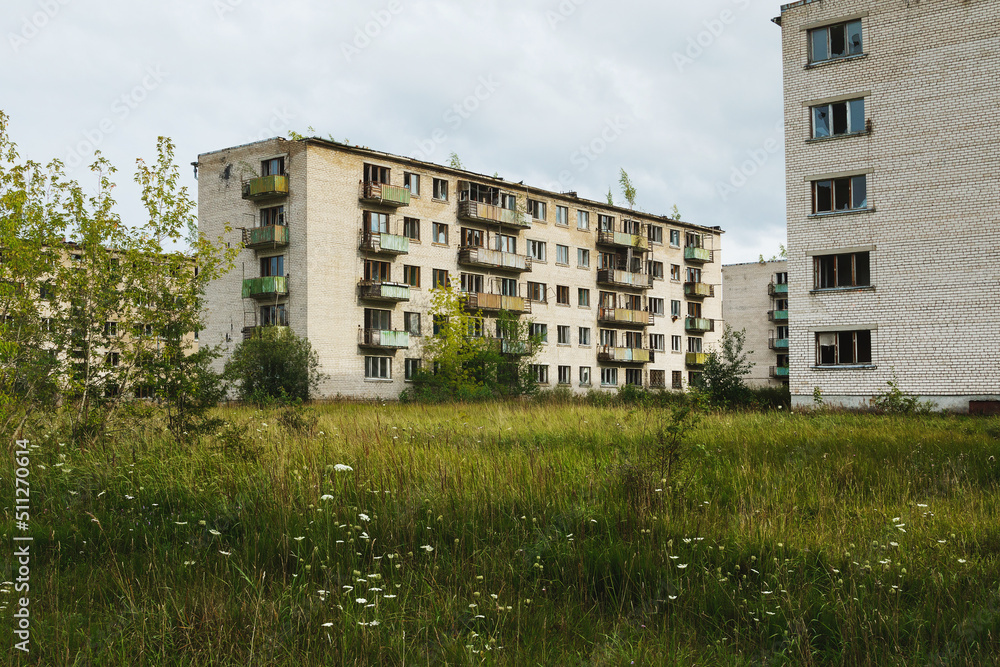 Exterior of abandoned apartment buildings in european ghost town.