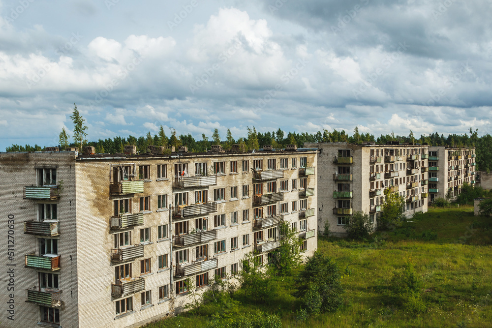 Exterior of abandoned apartment buildings in european ghost town.