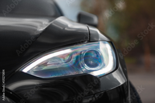 Led headlight of modern car. Close up view © Moose