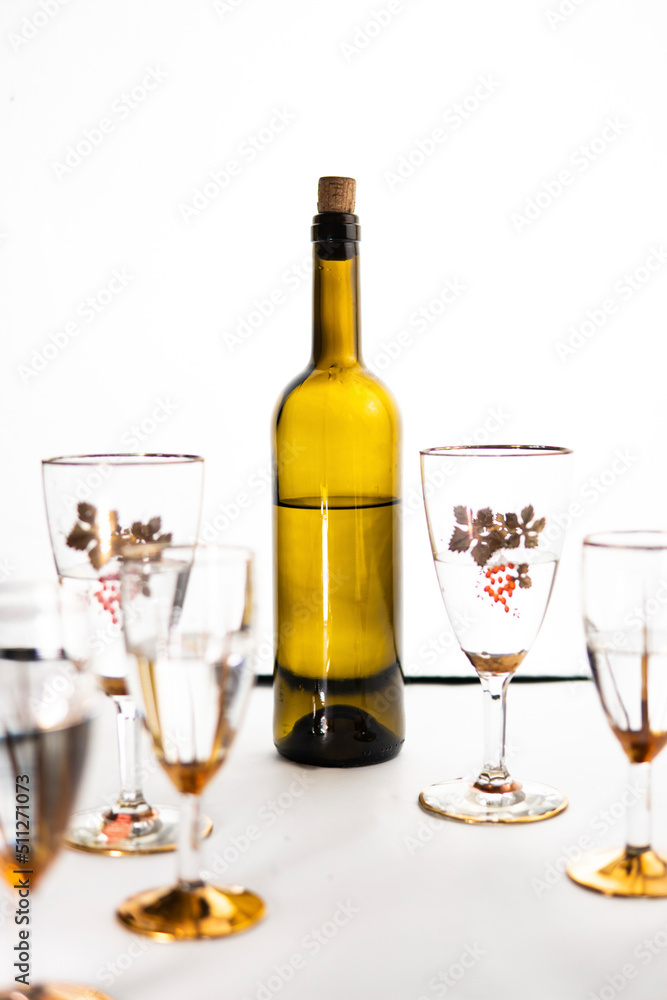 bottle of wine and glasses on a white background bottle of wine and glasses on a white background