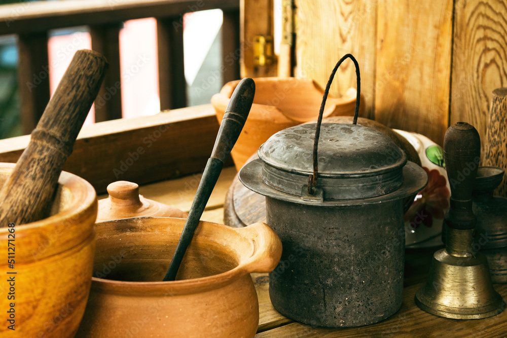 Closeup of handicraft made kitchenware on wooden table in rural house. Closeup of handicraft made kitchenware on wooden table in rural house.