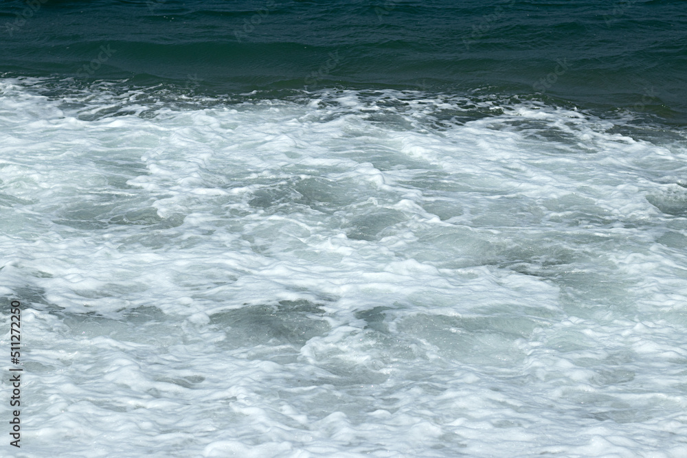 Natural wavy background of blue bubbling sea water. Natural wavy background of blue bubbling sea water.