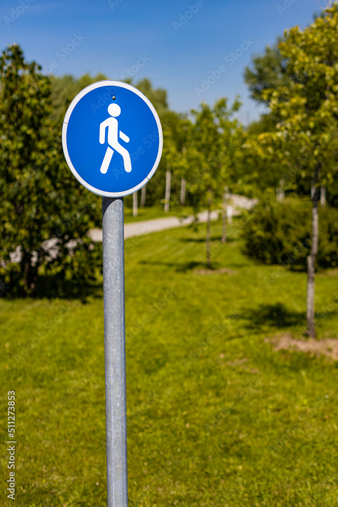 a sign in the park indicating a pedestrian zone a sign in the park indicating a pedestrian zone
