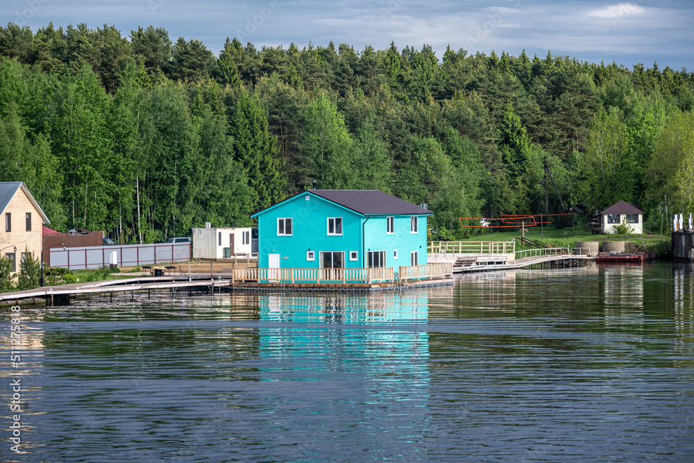 Naklejka premium landscape with a view from the river boat to the coastline on a summer day