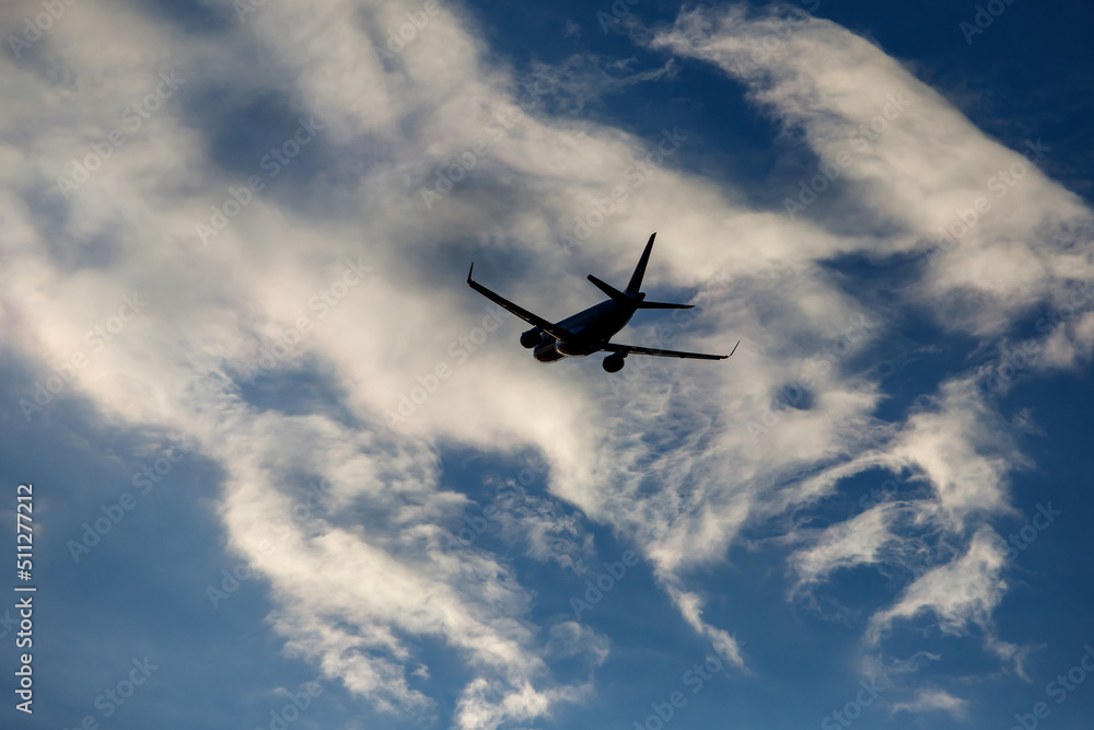 Airplane in the cloudy sky. Airplane in the cloudy sky.