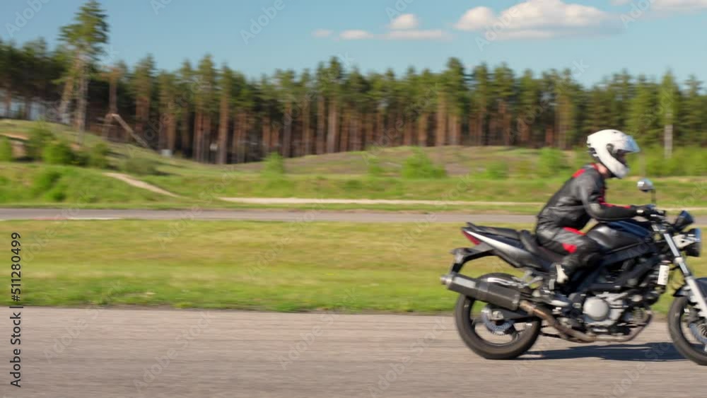 Cornering a roadster motorbike on a high octane race circuit