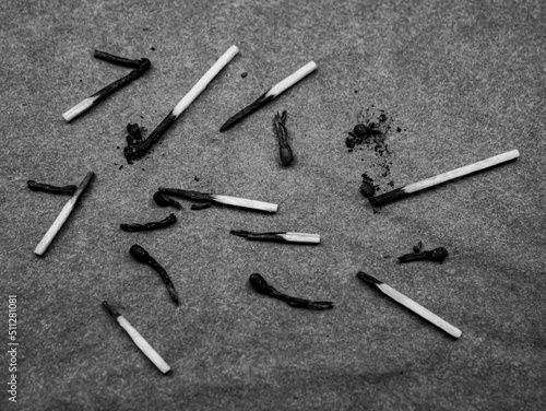 Burnt matches on a dark background. Burnt wooden matches.