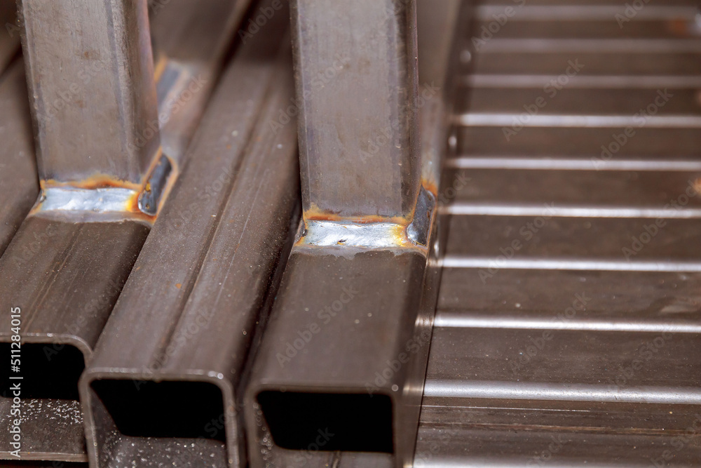 Metal square profiles welded in the frame. Welding work in production. Metal square profiles welded in the frame. Welding work in production.