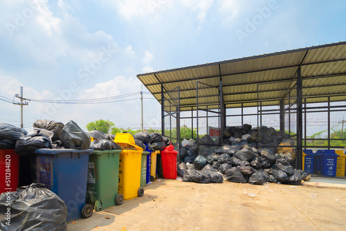 Stack of different types of large garbage pile, plastic bags, and trash in industrial factory in environmental pollution. Waste disposal in dumping site in urban city.