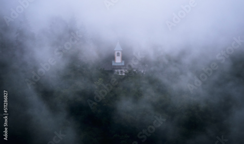 Church in the misty forest