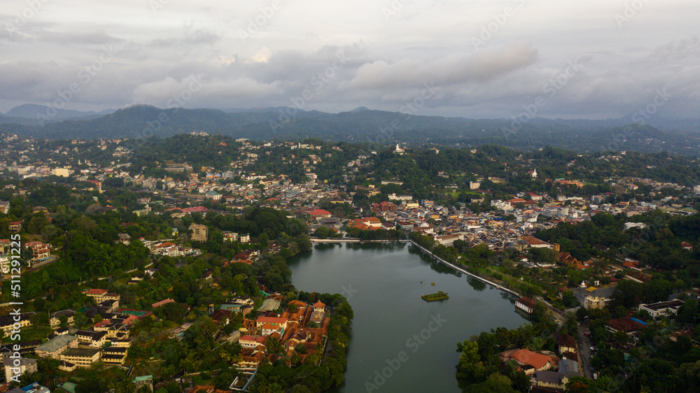 The city of Kandy is surrounded by high mountains covered with jungle and tropical vegetation