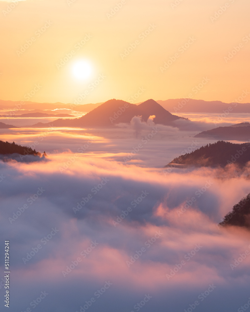 Obraz premium Sunrise above the clouds and mountains. Calming, relaxing, peaceful. 