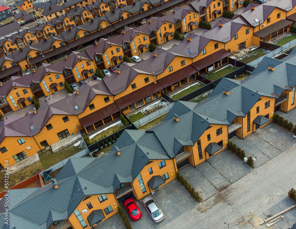Aerial drone sunrise view of suburban houses in Aerial drone sunrise view of suburban houses in