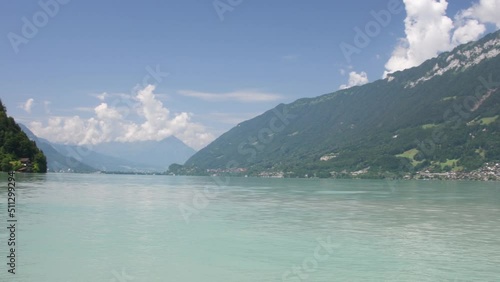 Beautiful view of the lake on a sunny summer day, Brienz lake with clear turquoise water. Brienz lake in the village of Iseltwald, Switzerland