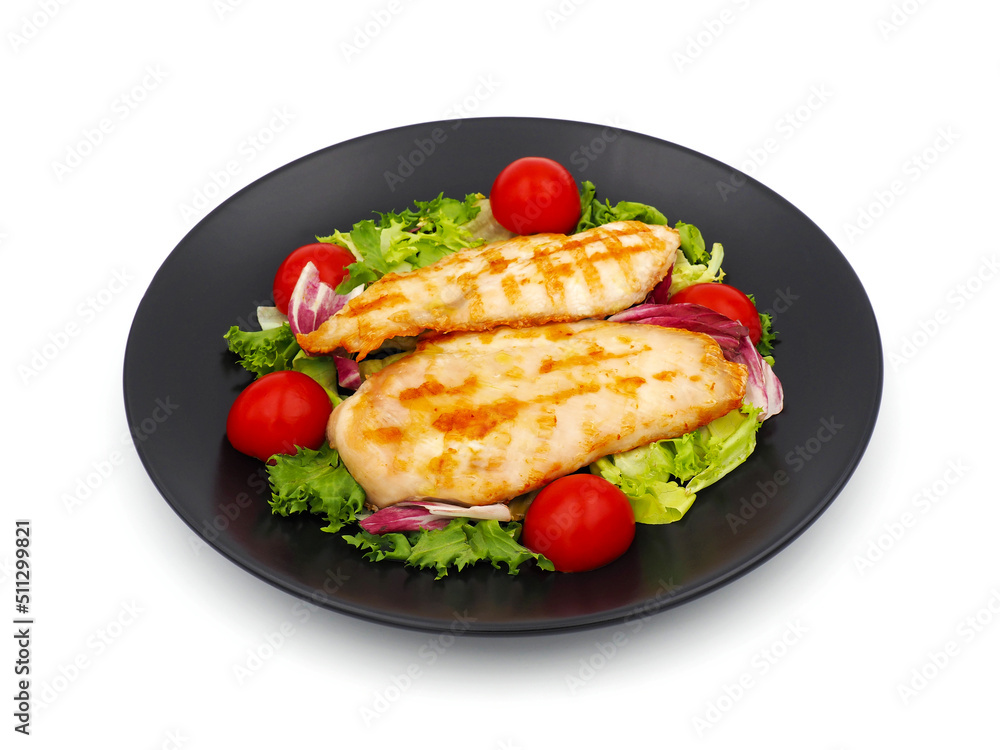 Grilled chicken breast with green salad and tomatoes isolated on white background Grilled chicken breast with green salad and tomatoes isolated on white background