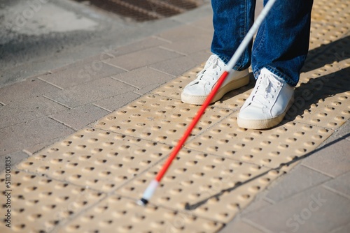 Fotografía Close-up Of A Blind Man Standing With White Stick On Street