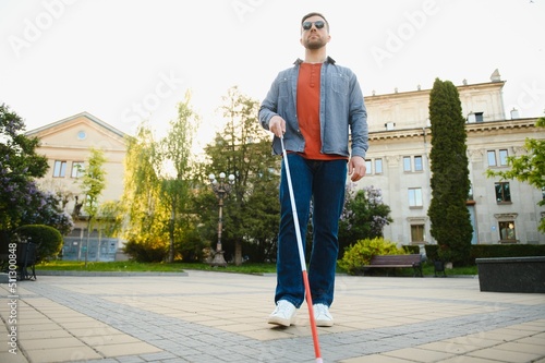 Close-up Of A Blind Man Standing With White Stick On Street