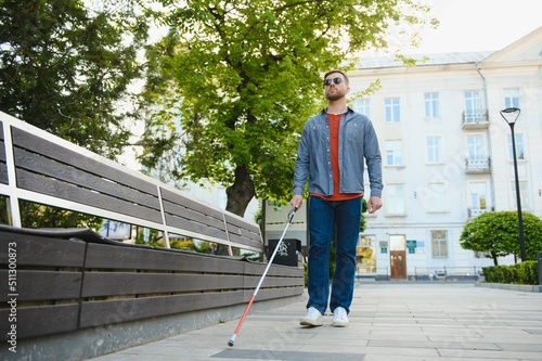 Close-up Of A Blind Man Standing With White Stick On Street