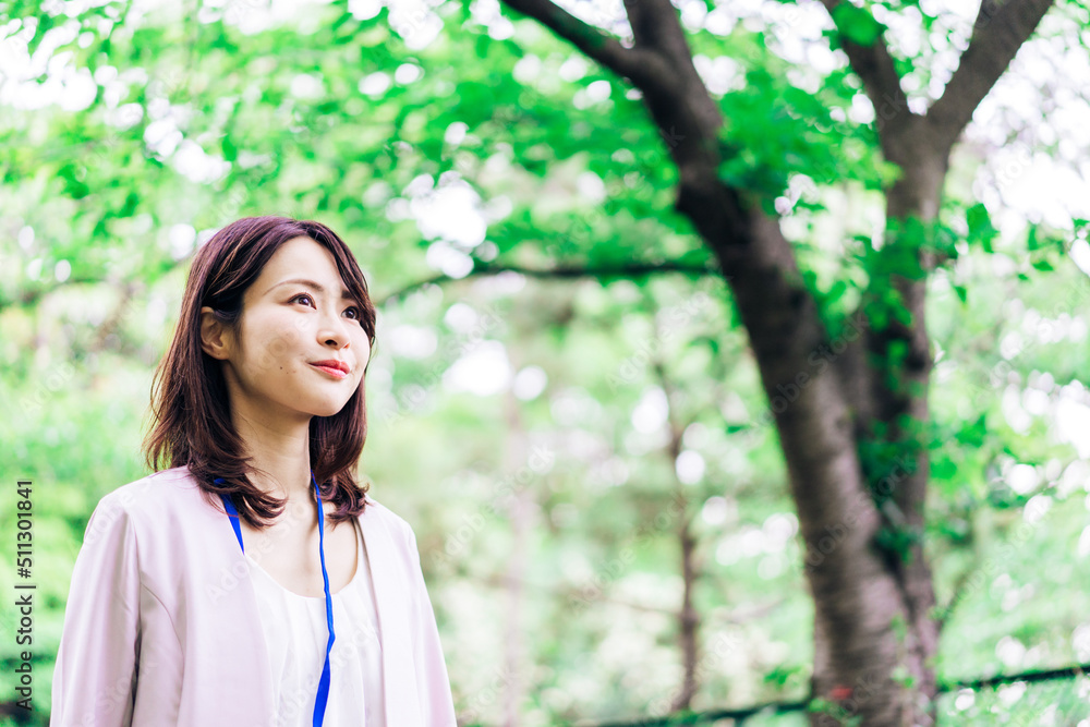 Business woman refreshing herself outside Business woman refreshing herself outside