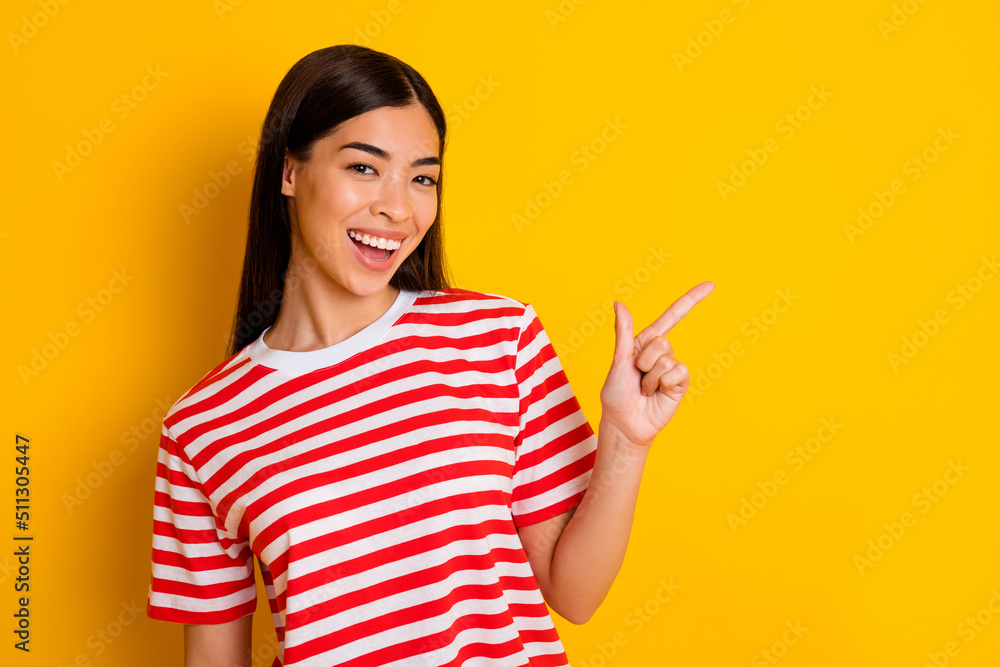 Portrait of cheerful funny person indicate finger empty space toothy smile wear red white isolated on yellow color background Portrait of cheerful funny person indicate finger empty space toothy smile wear red white isolated on yellow color background