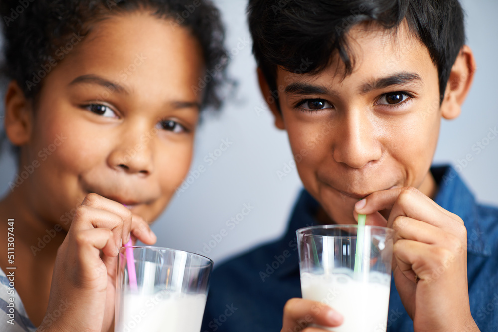 Calcium for healthy bones. A brother and sister drinking milk together. Calcium for healthy bones. A brother and sister drinking milk together.