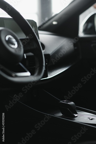 car interior. Modern car speedometer and illuminated dashboard. Luxurious car instrument cluster. Close up shot of hybrid car instrument panel © Serhii
