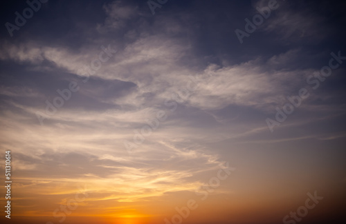 Sunset background.Gradient Sky and Cloud soft Red and Orange Hot color Sunshine.Light Sunrise Warm Clear Nature Backdrop.Free space.Card Poster for Tropical Travel Summer Holiday Concept