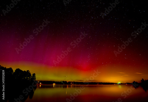 Northern Lights (Aurora Borealis) lighting up the sky on a beautiful summer night west of Ottawa, Canada 