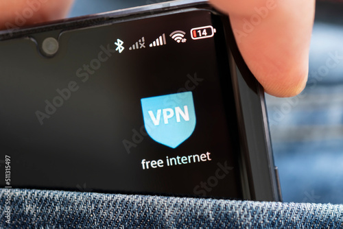 VPN - Virtual Private Network - Cyber Security and Privacy Data Encryption Software Solutions for Business concept. A smartphone with vpn app for anonymous internet using, unblock websites photo