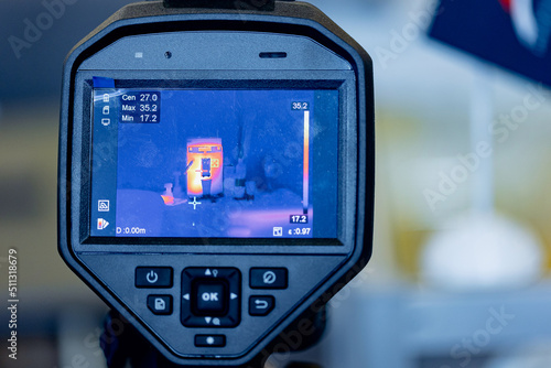 Worker use thermal IR imaging camera to check temperature for industrial work