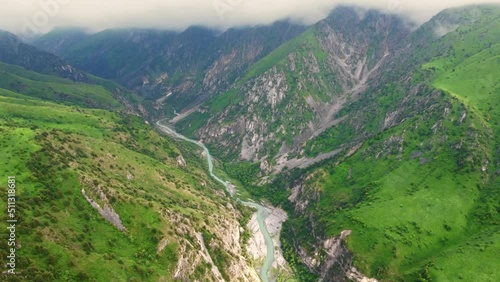 Top view of Aksu river in Aksu Zhabagly nature reserve, beautiful meandering river in canon in early spring Kazakhstan
