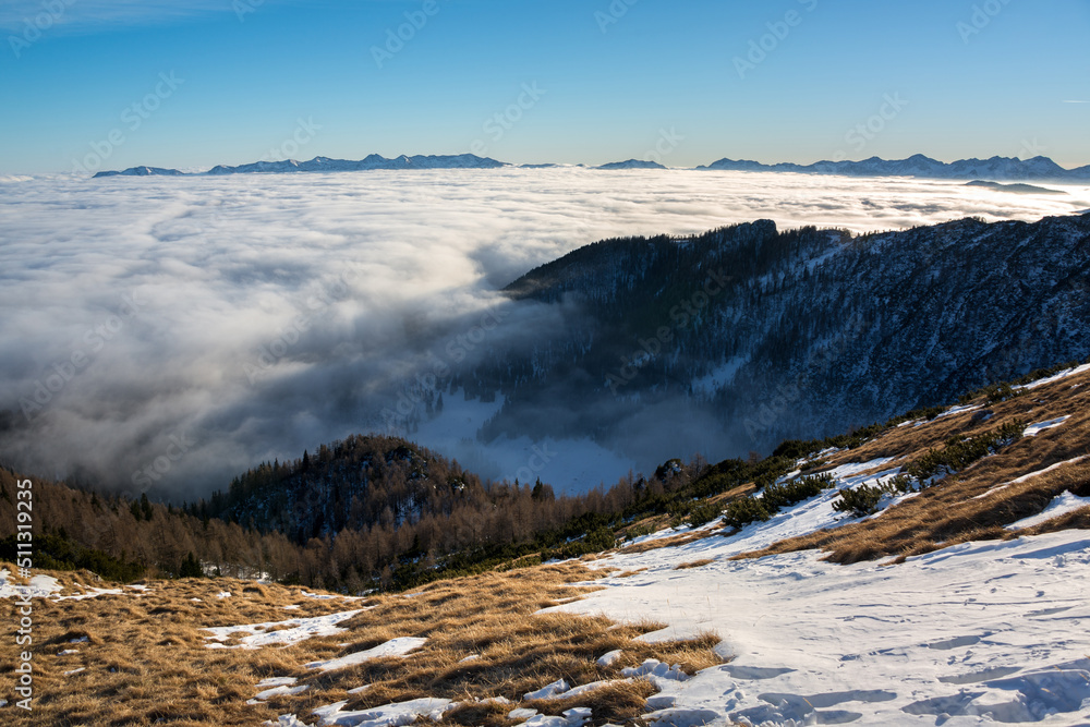 Sunset in the mountains with fog in the valley