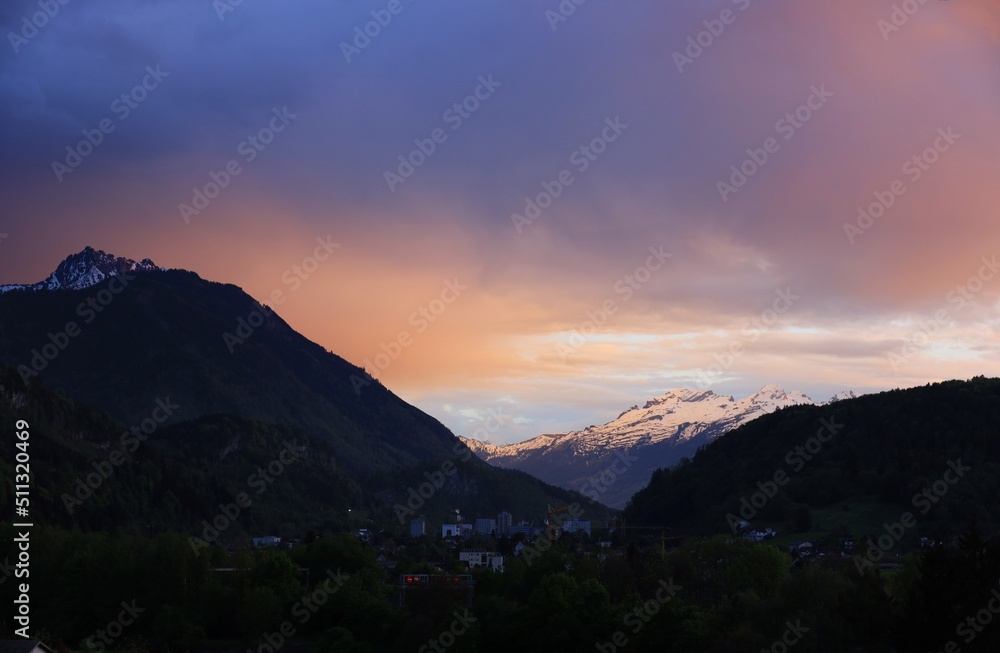 Amazing sunset in Austrian Alps. Mountains tops covered with snow