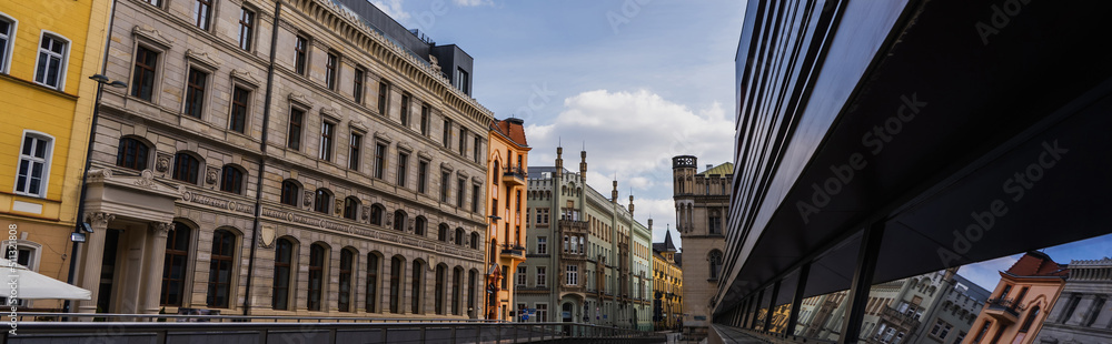 Buildings on urban street at daytime in Wroclaw, banner