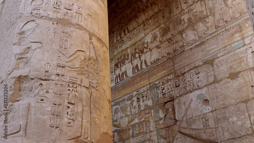 Ancient drawings on the walls of the Medinet Habu Temple in Luxor, Egypt Ancient drawings on the walls of the Medinet Habu Temple in Luxor, Egypt