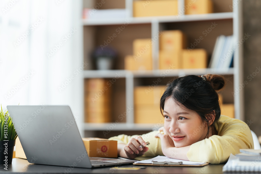 Portrait young attractive asian female owner startup business work happy with box at home prepare parcel delivery in sme supply chain, start up small business concept. Portrait young attractive asian female owner startup business work happy with box at home prepare parcel delivery in sme supply chain, start up small business concept.