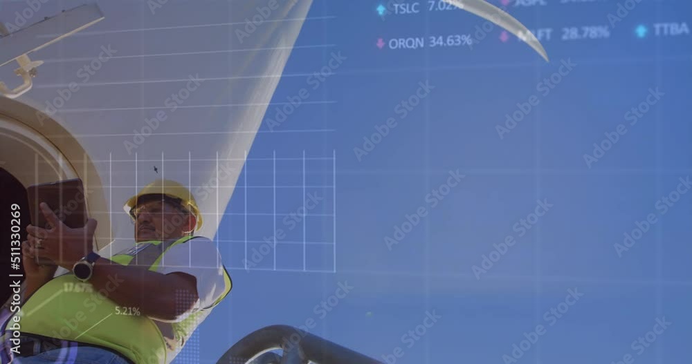 Animation of financial graphs over biracial man with tablet and wind turbine