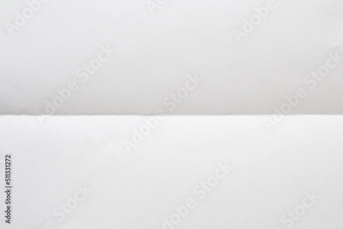 White folded and wrinkled paper texture background