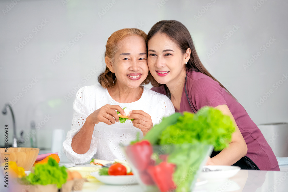 mother and daughter cooking in the kitchen, mother and daughter hugging to love on mother's day, Asian family mother and daughter cooking in the kitchen, mother and daughter hugging to love on mother's day, Asian family